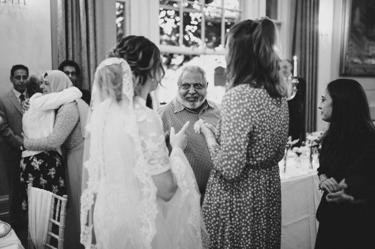 Black and white photo of the bride and her guests.